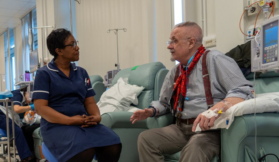 A-nurse-and-an-elderly-patient-engage-in-conversation